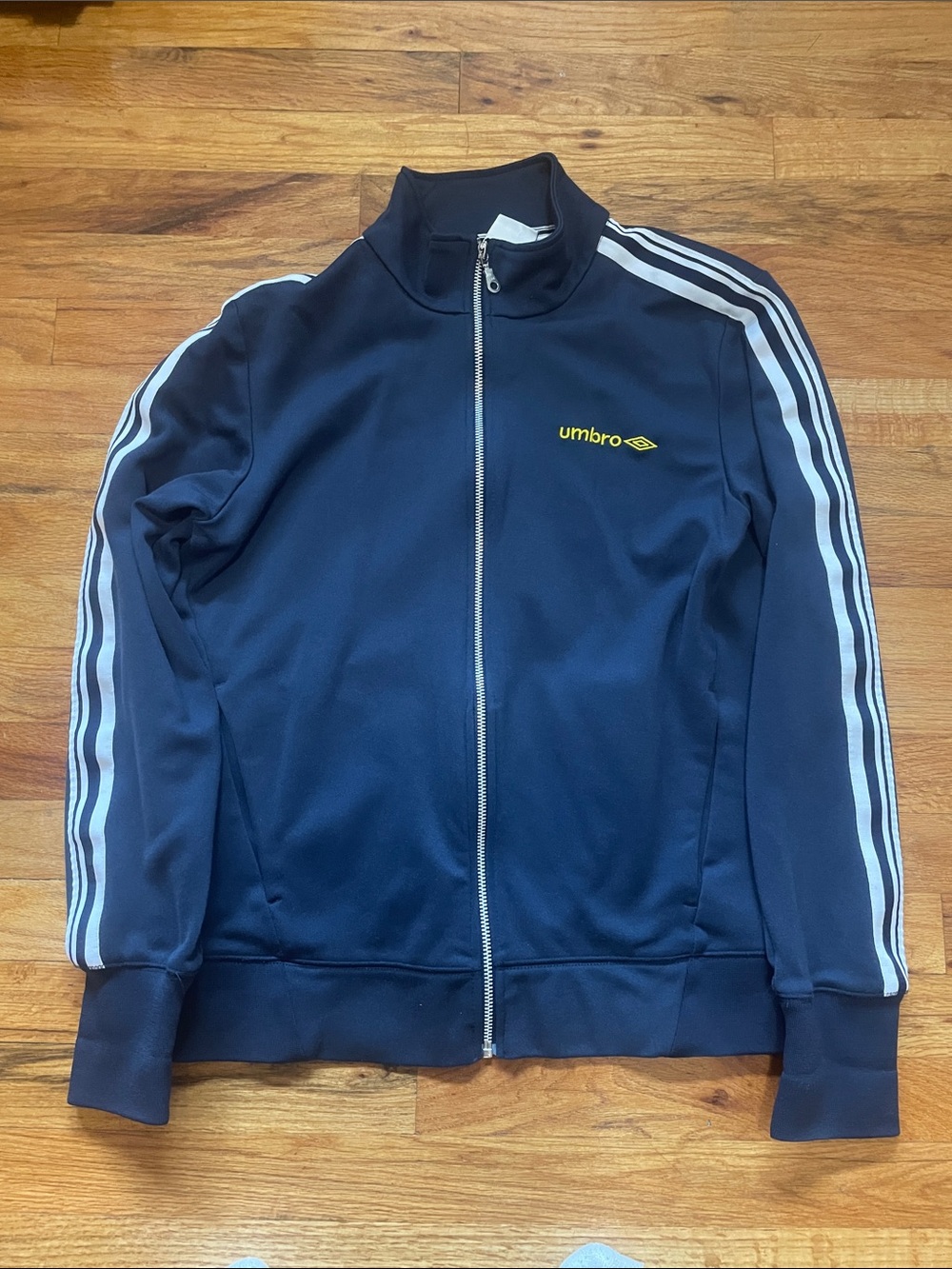 Umbro Navy Track Jacket with White Stripe Accents and Yellow Logo